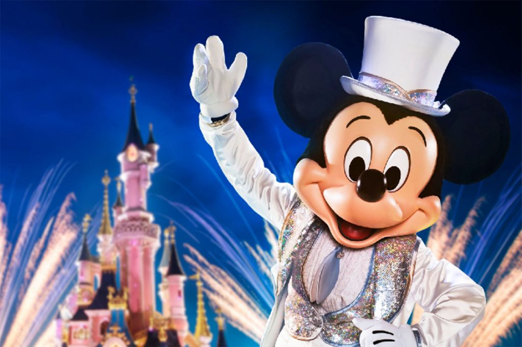 Mickey Mouse celebrates Disney New Years Eve Party in front of Sleeping Beauty Castle at Disneyland Paris